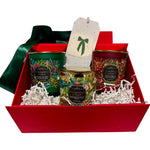 Gift basket with three candles in a red box on a white background