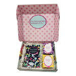 Gift box with polka dot lid containing three books titled 'Way Maker', 'Miracle Worker', and 'Promise Keeper'.